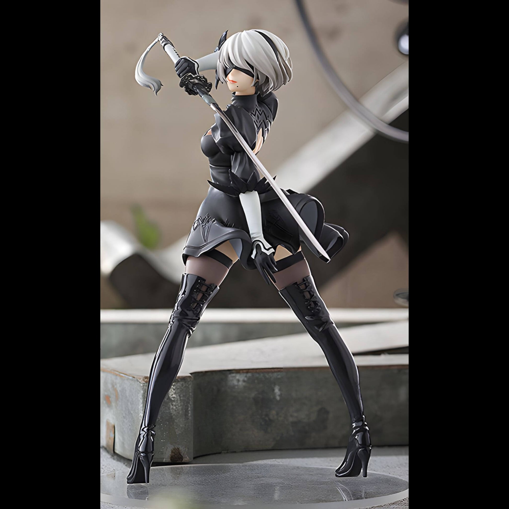 Good Smile Company NieR Automata Pop Up Parade 2B (YoRHa No.2 Type B) Figure in a black outfit with a weapon on a setup background