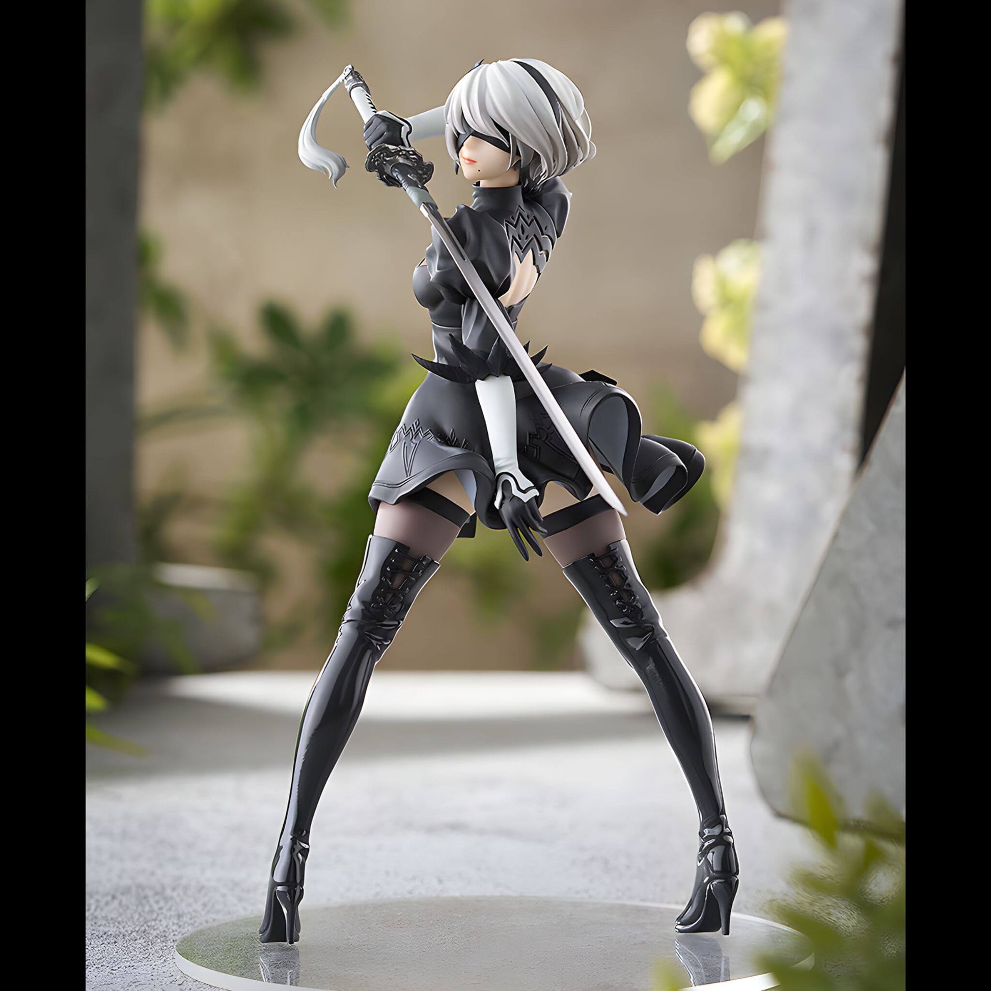 Good Smile Company NieR Automata Pop Up Parade 2B (YoRHa No.2 Type B) Figure in a dynamic pose with a sword, standing in outdoors setup.