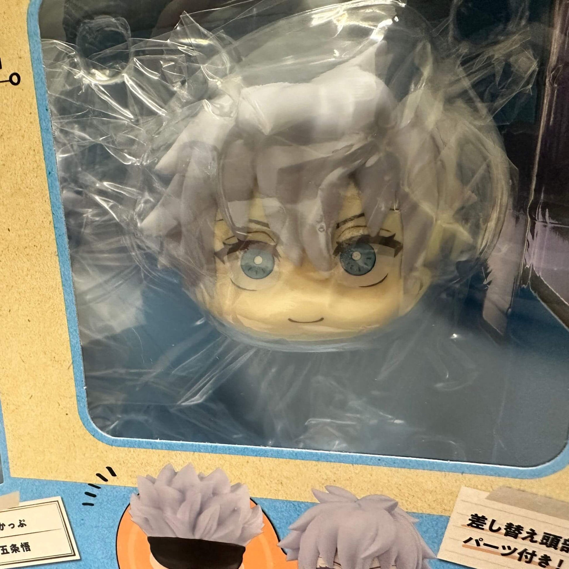 Plastic-wrapped Megahouse Jujutsu Kaisen Look Up Series Satoru Gojo Figure with a beige head and gray hair in a box.