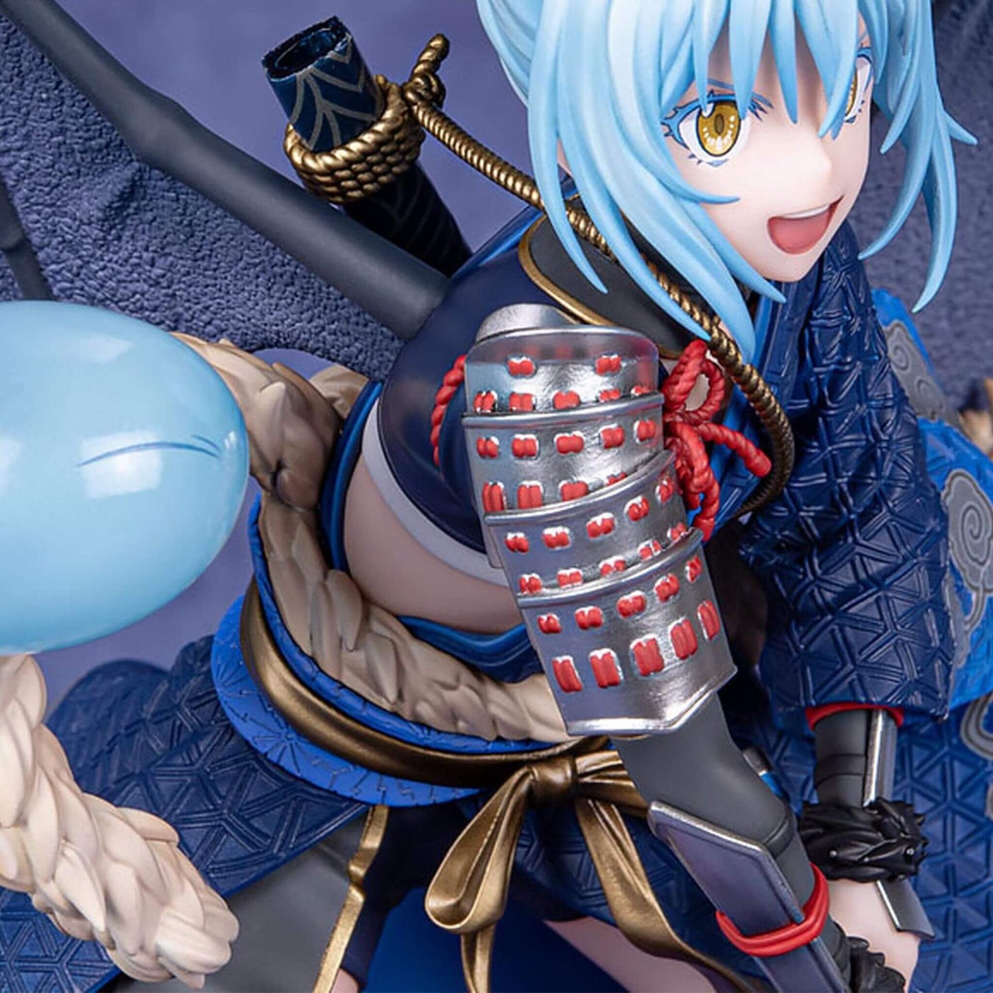 Close up view of That Time I Got Reincarnated as a Slime Figurine of Rimuru Tempest with blue hair and a sword, wearing traditional armor.