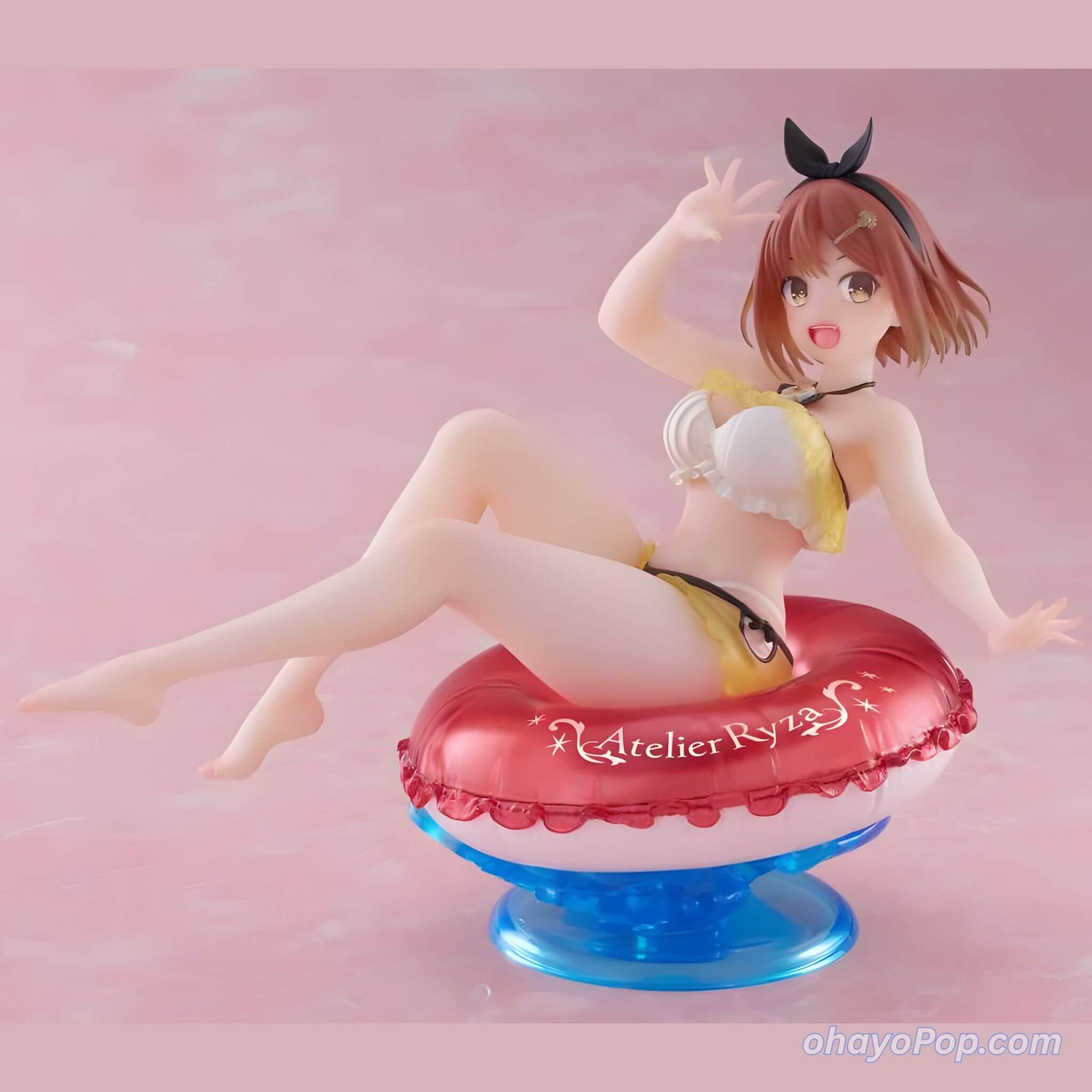 Anime character figurine of Ryza on a pool float with a pink background