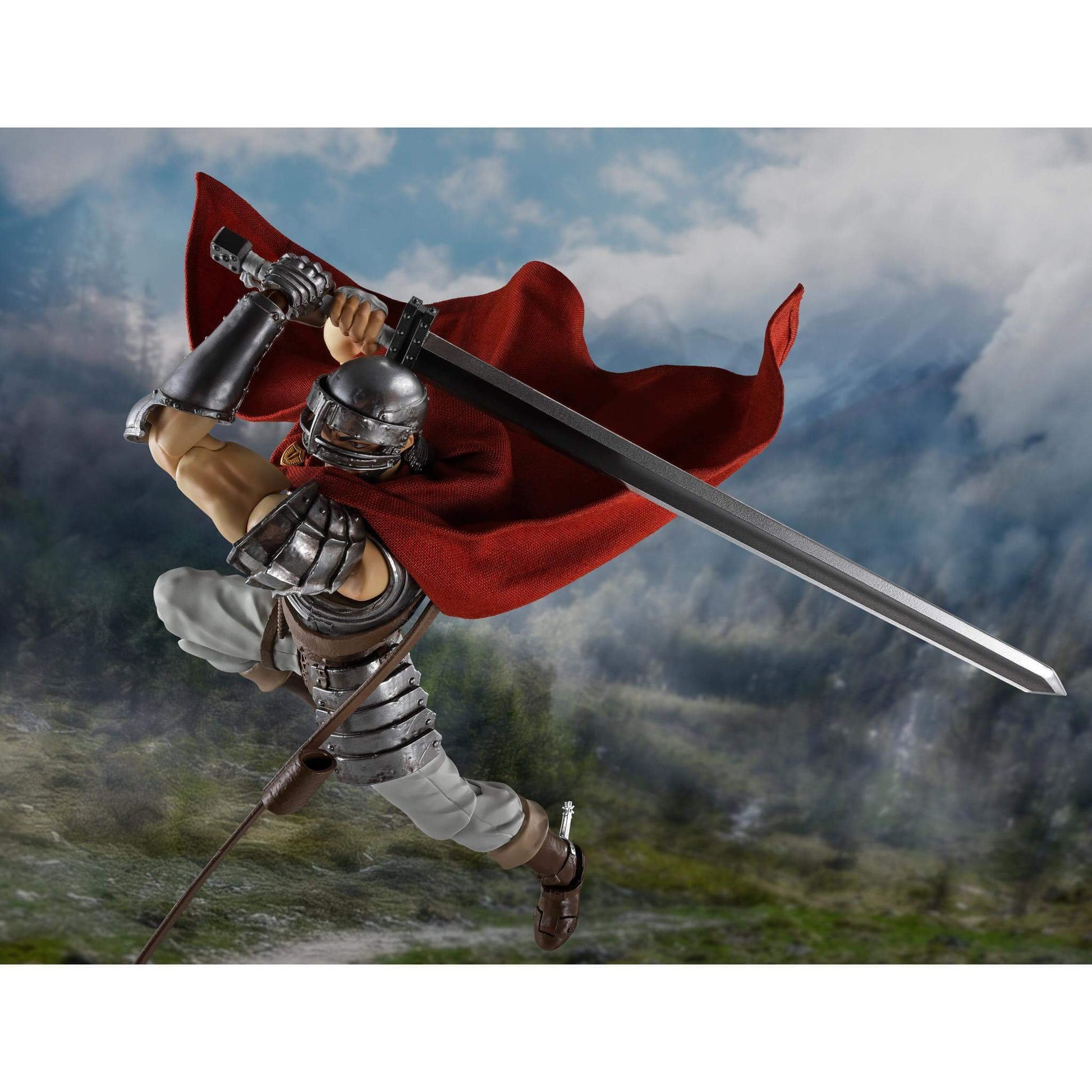 Berserk S.H.Figuarts Action Figure of Guts with a red cape and sword against a mountainous background