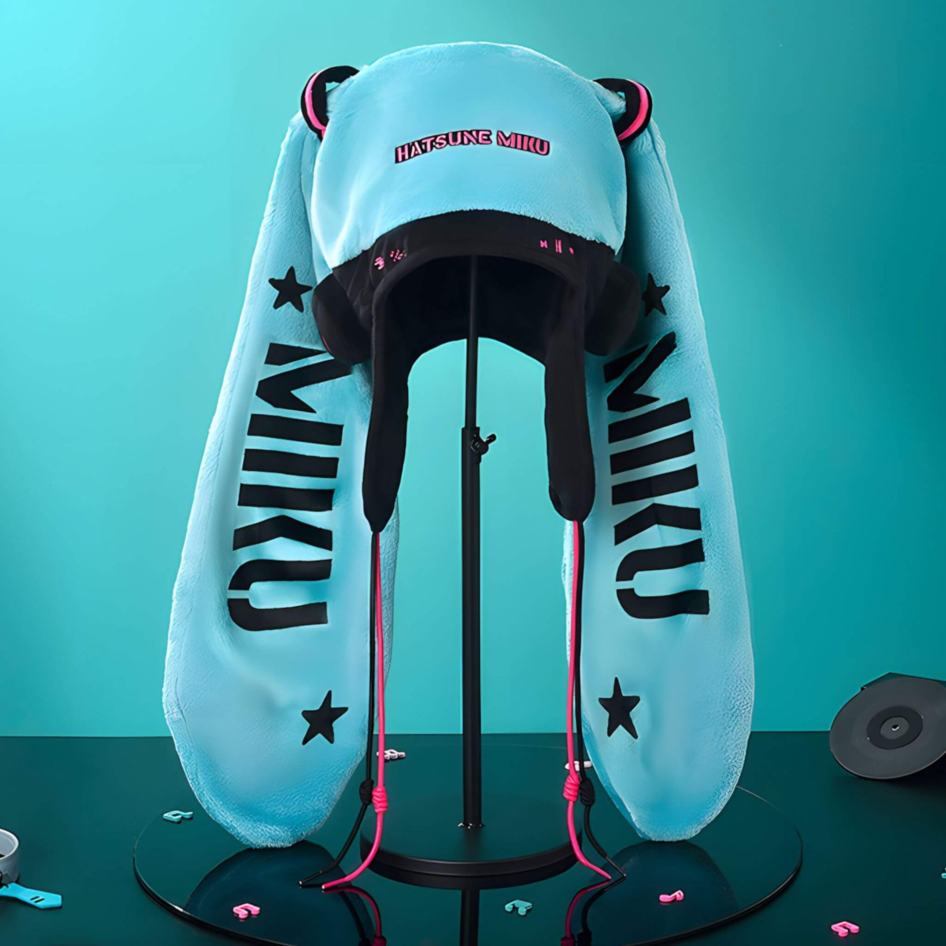 Hatsune Miku Character Hat with 'MIKU' branding on a stand against a teal background