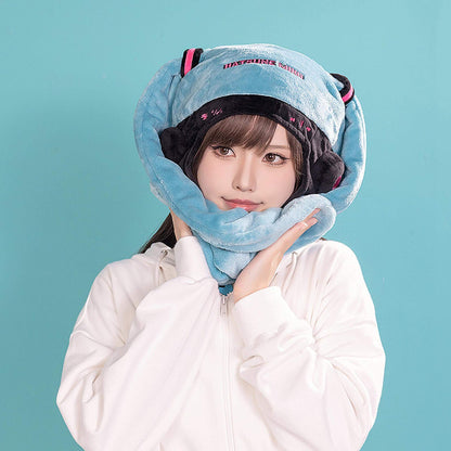 Person wearing a Hatsune Miku Character Hat against a teal background