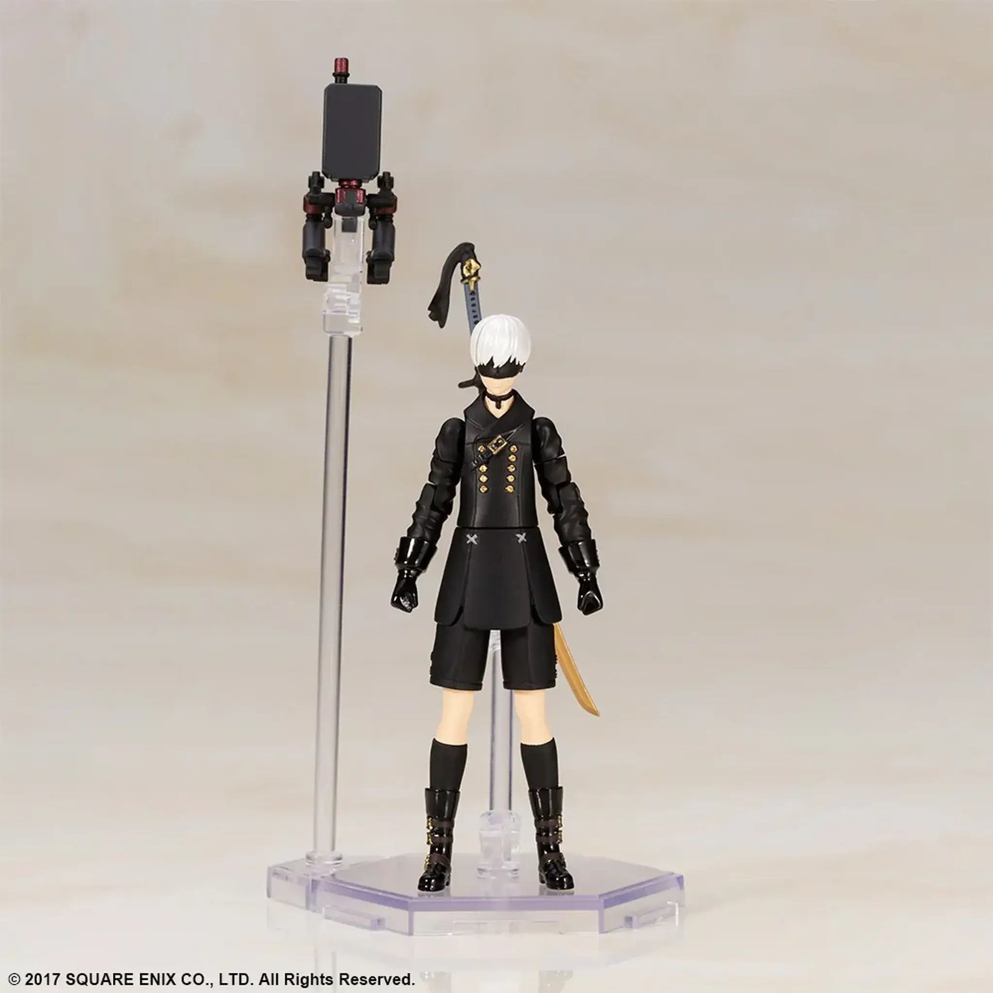 9S Action figure on a stand with his pod on a neutral background