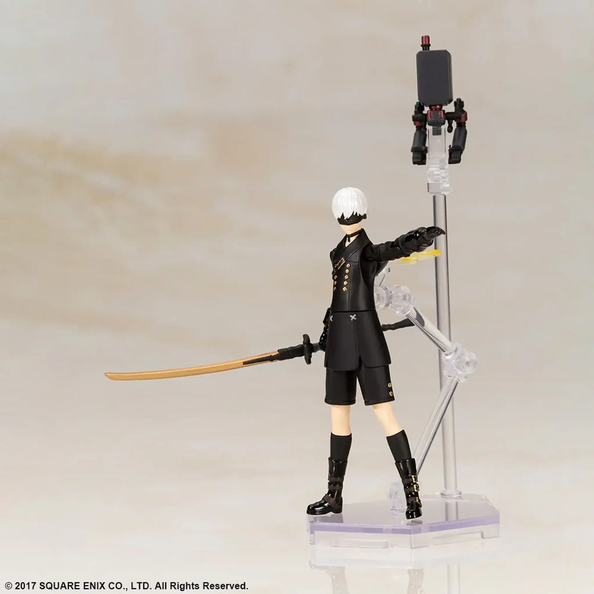 Nier Automata 9S action figure in black outfit with a sword on a stand against a plain background