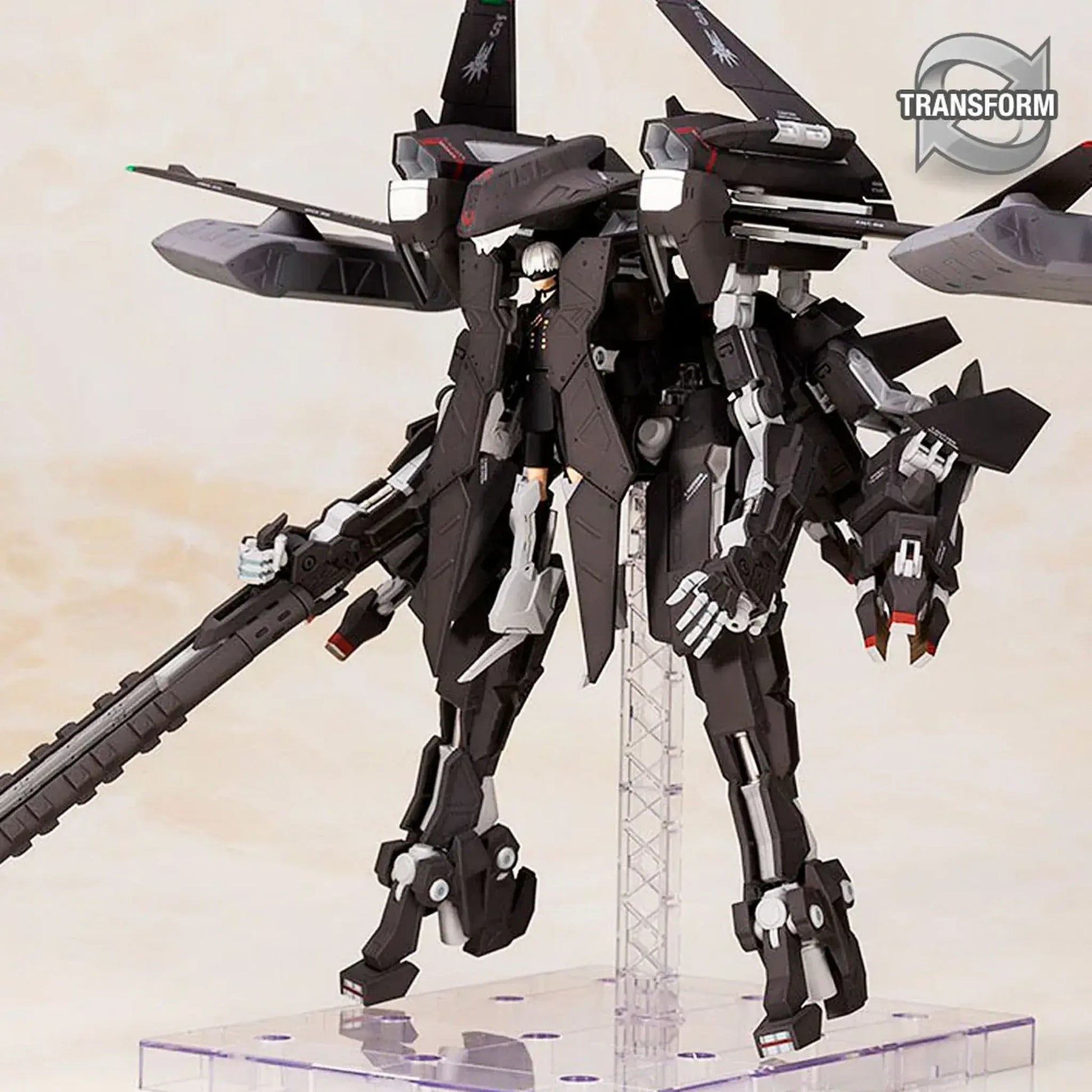 Nier Automata Flight Unit and 9S transformable model with fighter jet wings on a beige background