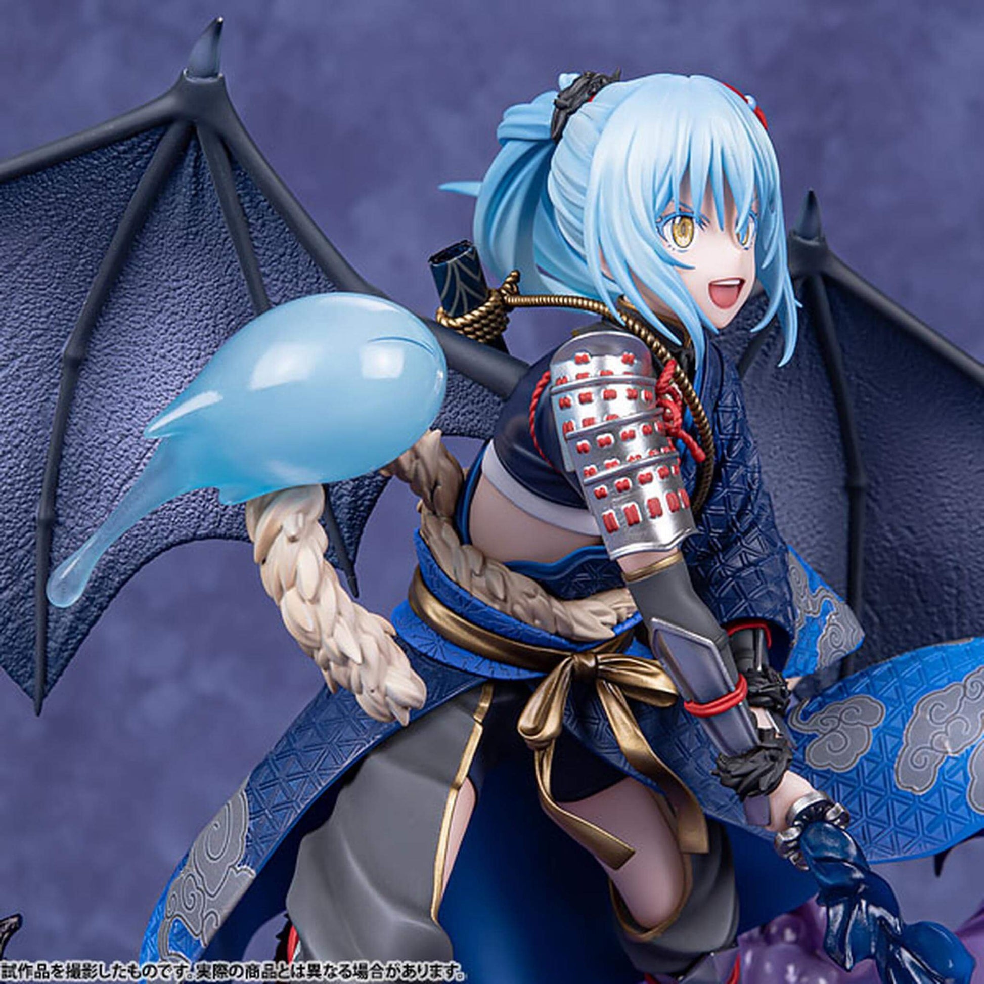 That Time I Got Reincarnated as a Slime Figurine of Rimuru Tempest with blue hair and dragon-like wings holding a microphone.