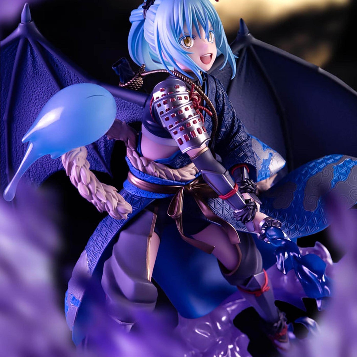 That Time I Got Reincarnated as a Slime Figurine of Rimuru Tempest with blue hair and purple outfit holding a microphone.
