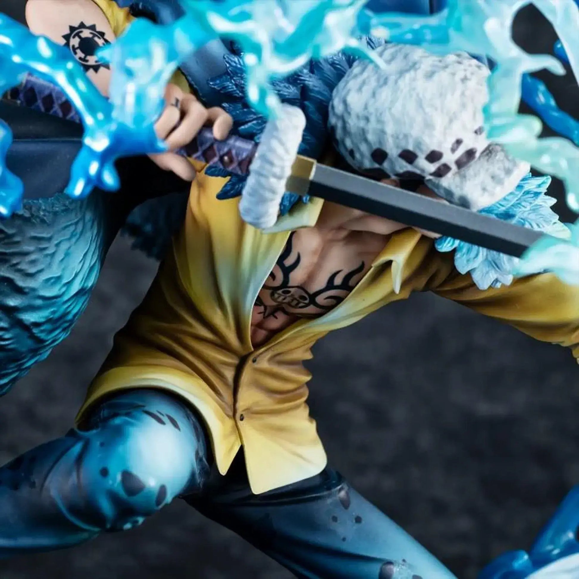 One Piece Portrait Of Pirates WA-MAXIMUM Trafalgar Law "The Surgeon of Death" (Awaken) figure with blue and yellow outfit holding a weapon against a dark background