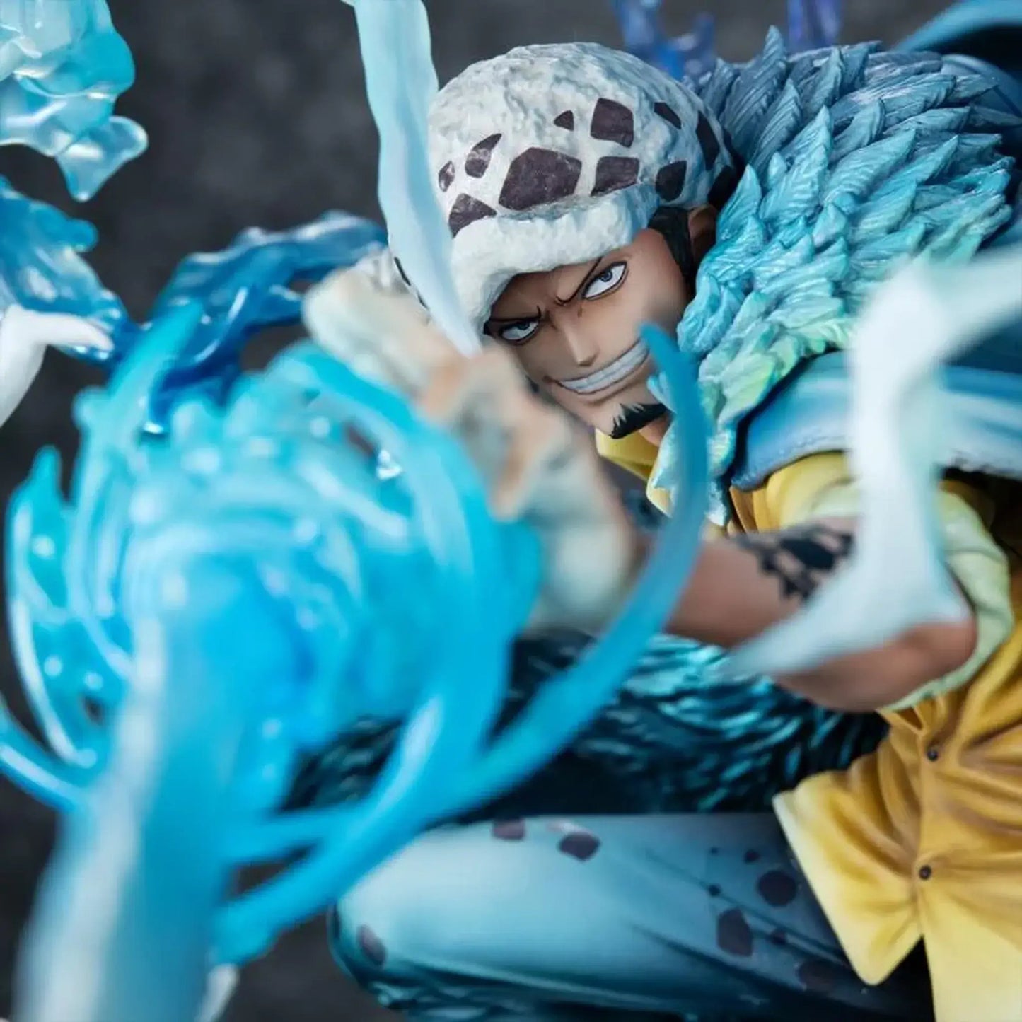 Close up view of One Piece Portrait Of Pirates WA-MAXIMUM Trafalgar Law "The Surgeon of Death" (Awaken) figure with blue energy effect on his sword and detailed costume