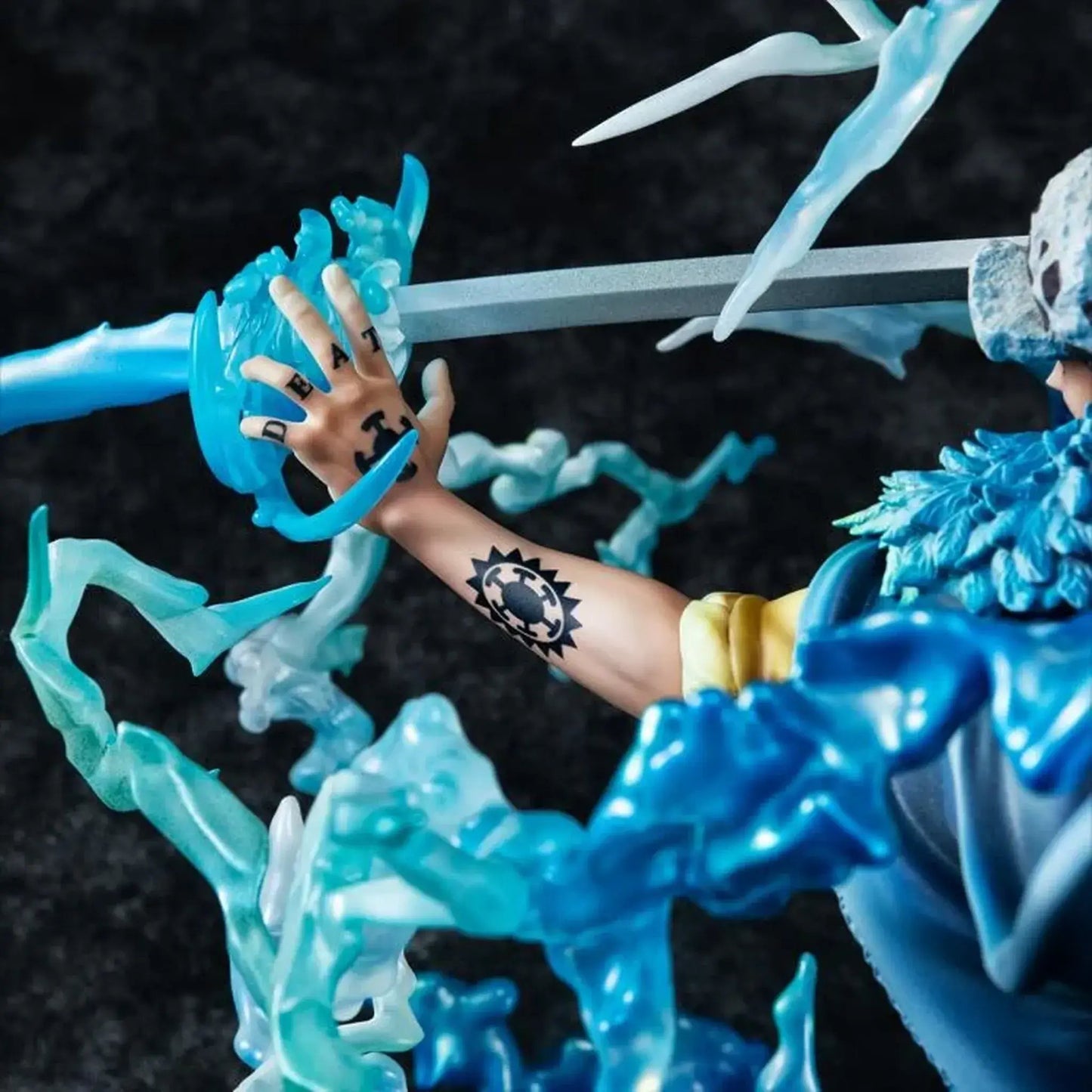 Close-up of One Piece Portrait Of Pirates WA-MAXIMUM Trafalgar Law "The Surgeon of Death" (Awaken) figure's hand with tattoos reaching towards a blue and white figure with a sword.